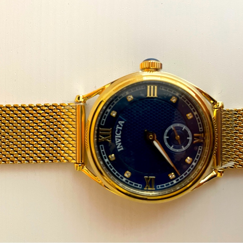 Invicta Women’s Gold Band and Blue Face Watch